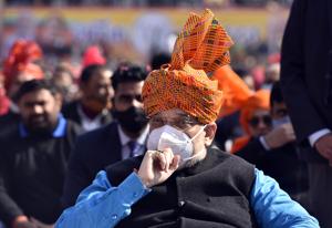 Union home minister Amit Shah listens to Prime Minister Narendra Modi's address on the new farm laws at a public gathering in New Delhi on Friday.(Sanjeev Verma/HT Photo) Union home minister Amit Shah listens to Prime Minister Narendra Modi's address on the new farm laws at a public gathering in New Delhi on Friday.(Sanjeev Verma/HT Photo)
