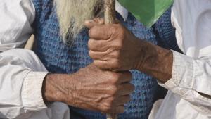 A farmer holds on to a flag while protesting against the Centre’s new farm laws at Singhu (Delhi-Haryana border) near New Delhi. Thousands of farmers from neighbouring states reached the national capital on November 27, responding to the “Delhi Chalo” call against the three laws -- the Farmers (Empowerment and Protection) Agreement of Price Assurance and Farm Services Act, 2020, the Farmers Produce Trade and Commerce (Promotion and Facilitation) Act, 2020, and the Essential Commodities (Amendment) Act 2020. (Vipin Kumar / HT Photo) A farmer holds on to a flag while protesting against the Centre’s new farm laws at Singhu (Delhi-Haryana border) near New Delhi. Thousands of farmers from neighbouring states reached the national capital on November 27, responding to the “Delhi Chalo” call against the three laws -- the Farmers (Empowerment and Protection) Agreement of Price Assurance and Farm Services Act, 2020, the Farmers Produce Trade and Commerce (Promotion and Facilitation) Act, 2020, and the Essential Commodities (Amendment) Act 2020. (Vipin Kumar / HT Photo)