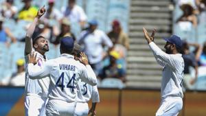 India's MD Siraj, left, celebrates after taking the wicket of Australia's Marnus Labuschagne during play on day one of the Boxing Day cricket test between India and Australia at the Melbourne Cricket Ground, Melbourne, Australia, Saturday, Dec. 26, 2020.(AP) India's MD Siraj, left, celebrates after taking the wicket of Australia's Marnus Labuschagne during play on day one of the Boxing Day cricket test between India and Australia at the Melbourne Cricket Ground, Melbourne, Australia, Saturday, Dec. 26, 2020.(AP)