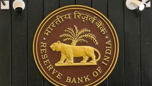 CCTV cameras are seen installed above the logo of Reserve Bank of India (RBI) inside its headquarters in Mumbai.(REUTERS) CCTV cameras are seen installed above the logo of Reserve Bank of India (RBI) inside its headquarters in Mumbai.(REUTERS)