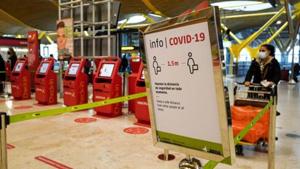 A Covid-19 information sign at the check-in area inside the departures hall at Madrid Barajas airport, operated by Aena SA, in Madrid, Spain.(Bloomberg) A Covid-19 information sign at the check-in area inside the departures hall at Madrid Barajas airport, operated by Aena SA, in Madrid, Spain.(Bloomberg)