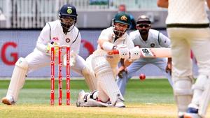 Matthew Wade sweeps as Rishabh Pant looks on.(Getty Images) Matthew Wade sweeps as Rishabh Pant looks on.(Getty Images)