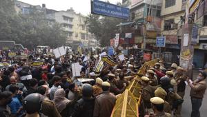 AAP supporters try to break through police barricades during a protest against the alleged MCD scam at Bara Tooti Chowk, in New Delhi.(Sanchit Khanna/HT PHOTO) AAP supporters try to break through police barricades during a protest against the alleged MCD scam at Bara Tooti Chowk, in New Delhi.(Sanchit Khanna/HT PHOTO)