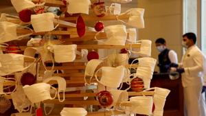 A Christmas tree is decorated with face masks inside a hotel lobby to create awareness about wearing a mask during the coronavirus disease (Covid-19) outbreak, ahead of Christmas celebrations, in Mumbai, India.(REUTERS) A Christmas tree is decorated with face masks inside a hotel lobby to create awareness about wearing a mask during the coronavirus disease (Covid-19) outbreak, ahead of Christmas celebrations, in Mumbai, India.(REUTERS)
