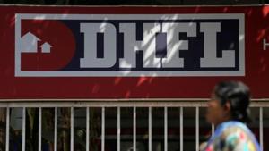 A woman walks past a signboard of Dewan Housing Finance Corporation Ltd. (DHFL) outside its office on the outskirts of Mumbai.(REUTERS) A woman walks past a signboard of Dewan Housing Finance Corporation Ltd. (DHFL) outside its office on the outskirts of Mumbai.(REUTERS)