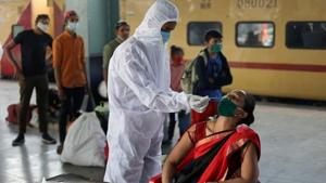 A health worker in personal protective equipment (PPE) collects a swab sample from a woman during a rapid antigen testing campaign for the coronavirus disease (Covid-19), at a railway station platform in Mumbai in this file photo.(Reuters Photo) A health worker in personal protective equipment (PPE) collects a swab sample from a woman during a rapid antigen testing campaign for the coronavirus disease (Covid-19), at a railway station platform in Mumbai in this file photo.(Reuters Photo)
