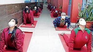 Students performing yoga on campus.(HT) Students performing yoga on campus.(HT)