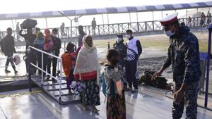 Rohingya refugees board a naval ship to be transported to an isolated island in the Bay of Bengal, in Chittagong, Bangladesh, Tuesday, Dec. 29, 2020. (AP Photo/Mahmud Hossain Opu) Rohingya refugees board a naval ship to be transported to an isolated island in the Bay of Bengal, in Chittagong, Bangladesh, Tuesday, Dec. 29, 2020. (AP Photo/Mahmud Hossain Opu)