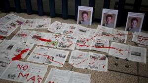 "No More Deaths" is written in red paint on newspapers placed in front of photos of murderd Mexican journalist Miroslava Breach, at the headquarters of Mexico's General Attorney's Office in Mexico City.(AP) "No More Deaths" is written in red paint on newspapers placed in front of photos of murderd Mexican journalist Miroslava Breach, at the headquarters of Mexico's General Attorney's Office in Mexico City.(AP)