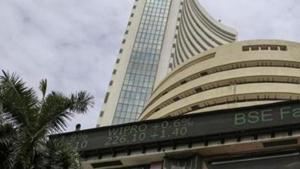 A pedestrian wearing a protective mask walks past the Bombay Stock Exchange (BSE) building in Mumbai.(Bloomberg) A pedestrian wearing a protective mask walks past the Bombay Stock Exchange (BSE) building in Mumbai.(Bloomberg)