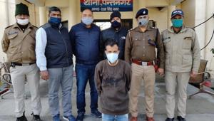 A man wanted for nine years for abducting and looting a general manager of a five star hotel after his arrest by STF in US Nagar.(HT Photo) A man wanted for nine years for abducting and looting a general manager of a five star hotel after his arrest by STF in US Nagar.(HT Photo)