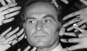 French fashion designer Pierre Cardin's face is framed by 10 hands of models ornamented with a collection of rings designed by Cardin from his latest jewellery collection, in Paris, France.(Associated Press) French fashion designer Pierre Cardin's face is framed by 10 hands of models ornamented with a collection of rings designed by Cardin from his latest jewellery collection, in Paris, France.(Associated Press)