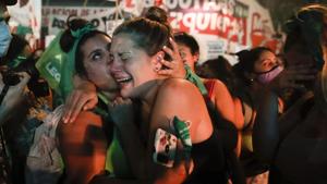 Abortion-rights activists react after lawmakers approved a bill that legalizes abortion, outside Congress in Buenos Aires, Argentina.(AP) Abortion-rights activists react after lawmakers approved a bill that legalizes abortion, outside Congress in Buenos Aires, Argentina.(AP)