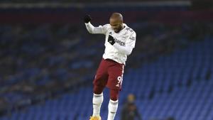 Arsenal's Alexandre Lacazette leaps in the air at the final whistle of the English Premier League soccer match between Brighton and Arsenal at the Falmer stadium in Brighton.(AP) Arsenal's Alexandre Lacazette leaps in the air at the final whistle of the English Premier League soccer match between Brighton and Arsenal at the Falmer stadium in Brighton.(AP)