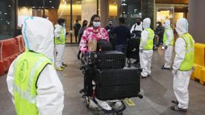 Passengers wearing protective face masks leave upon arrival at Chhatrapati Shivaji Maharaj International Airport after India cancelled all flights from the UK over fears of a new strain of the coronavirus disease (Covid-19), in Mumbai.(REUTERS) Passengers wearing protective face masks leave upon arrival at Chhatrapati Shivaji Maharaj International Airport after India cancelled all flights from the UK over fears of a new strain of the coronavirus disease (Covid-19), in Mumbai.(REUTERS)