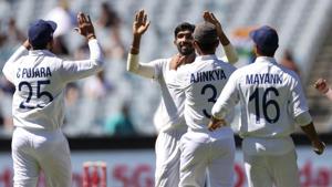 Jasprit Bumrah, centre, is congratulated by teammates after taking the wicket of Australia's Joe Burns for no score during play on day one of the Boxing Day cricket test between India and Australia at the Melbourne Cricket Ground.(AP) Jasprit Bumrah, centre, is congratulated by teammates after taking the wicket of Australia's Joe Burns for no score during play on day one of the Boxing Day cricket test between India and Australia at the Melbourne Cricket Ground.(AP)