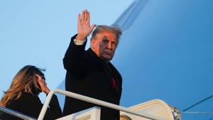 US President Donald Trump waves as he boards Air Force One beside first lady Melania Trump at Joint Base Andrews in Maryland.(REUTERS) US President Donald Trump waves as he boards Air Force One beside first lady Melania Trump at Joint Base Andrews in Maryland.(REUTERS)