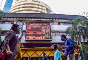 Mumbai: People walk past the Bombay Stock Exchange (BSE) building in Mumbai, Monday, Dec. 21, 2020. (PTI Photo) Mumbai: People walk past the Bombay Stock Exchange (BSE) building in Mumbai, Monday, Dec. 21, 2020. (PTI Photo)