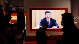 Visitors are seen near a screen showing Chinese President Xi Jinping during an exhibition on the fight against the coronavirus disease (Covid-19) outbreak, at Wuhan Parlor Convention Center that previously served as a makeshift hospital for Covid-19 patients in Wuhan, Hubei province.(REUTERS) Visitors are seen near a screen showing Chinese President Xi Jinping during an exhibition on the fight against the coronavirus disease (Covid-19) outbreak, at Wuhan Parlor Convention Center that previously served as a makeshift hospital for Covid-19 patients in Wuhan, Hubei province.(REUTERS)