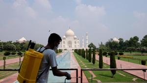 A man sanitizes railings in the premises of Taj Mahal after authorities reopened the monument to visitors, amidst the coronavirus disease (Covid-19) outbreak, in Agra, India.(REUTERS) A man sanitizes railings in the premises of Taj Mahal after authorities reopened the monument to visitors, amidst the coronavirus disease (Covid-19) outbreak, in Agra, India.(REUTERS)