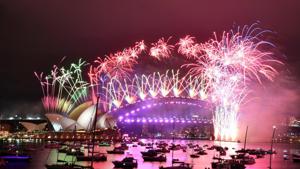 Fireworks explode over the Sydney Opera House and Sydney Harbour Bridge during downsized New Year's Eve celebrations during the COVID-19 pandemic, in Australia.(via REUTERS) Fireworks explode over the Sydney Opera House and Sydney Harbour Bridge during downsized New Year's Eve celebrations during the COVID-19 pandemic, in Australia.(via REUTERS)
