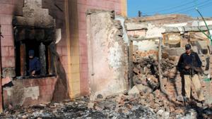Videos made by locals at the scene and shared with Reuters showed a crowd breaking apart blocks of the temple structure’s walls using stones and sledgehammers, as dark smoke from a large fire billowed into the sky.(AFP) Videos made by locals at the scene and shared with Reuters showed a crowd breaking apart blocks of the temple structure’s walls using stones and sledgehammers, as dark smoke from a large fire billowed into the sky.(AFP)