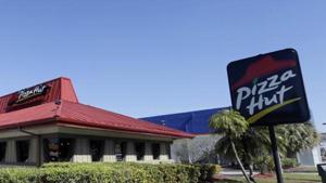 Pizza Hut said tax authorities had alerted it and other businesses in the sector to errors relating to deductions for staff uniform costs.(File photo / AP) Pizza Hut said tax authorities had alerted it and other businesses in the sector to errors relating to deductions for staff uniform costs.(File photo / AP)