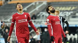 Liverpool's Mohamed Salah and Roberto Firmino.(Pool via REUTERS) Liverpool's Mohamed Salah and Roberto Firmino.(Pool via REUTERS)