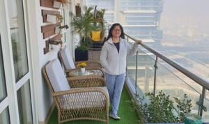 Sonali Khullar on the balcony of her 17th- floor flat in Gurugram. The family recently redecorated it to create different seating areas and a zone for drinks and snacks. Sonali Khullar on the balcony of her 17th- floor flat in Gurugram. The family recently redecorated it to create different seating areas and a zone for drinks and snacks.