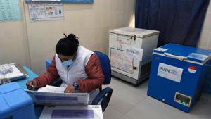 A healthcare worker make preparations inside a room at a vaccination center set up at a South Delhi Municipal Corp. maternity home ahead of a nationwide trial of a Covid-19 vaccine delivery system in New Delhi, India.(Bloomberg) A healthcare worker make preparations inside a room at a vaccination center set up at a South Delhi Municipal Corp. maternity home ahead of a nationwide trial of a Covid-19 vaccine delivery system in New Delhi, India.(Bloomberg)