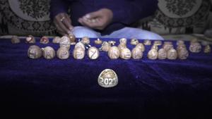 The image shows ‘Happy New Year 2021’ carved on betel nuts.(Twitter/@ANI) The image shows ‘Happy New Year 2021’ carved on betel nuts.(Twitter/@ANI)