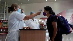 A traveller has her temperature checked at an airport.(Reuters File Photo) A traveller has her temperature checked at an airport.(Reuters File Photo)