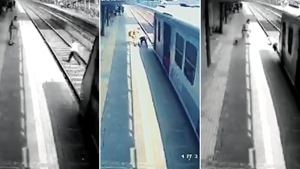 The man wore the shoe and tried climbing the platform even as the local train was barely a few metres away(Photo: ANI screengrab) The man wore the shoe and tried climbing the platform even as the local train was barely a few metres away(Photo: ANI screengrab)