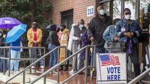 People wait in line on the first day of advance voting for Georgia's Senate runoff election at the Bell Auditorium in Augusta, Ga.(AP file photo) People wait in line on the first day of advance voting for Georgia's Senate runoff election at the Bell Auditorium in Augusta, Ga.(AP file photo)