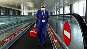 A laboratory technician carries swab samples collected from passengers amidst the spread of the coronavirus disease (Covid-19) at Indira Gandhi International Airport, in New Delhi.(REUTERS) A laboratory technician carries swab samples collected from passengers amidst the spread of the coronavirus disease (Covid-19) at Indira Gandhi International Airport, in New Delhi.(REUTERS)