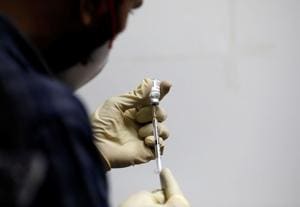 A medic fills a syringe with Covaxin, a government-backed experimental Covid-19 vaccine, before administering it to a health worker during its trials.(Reuters File Photo) A medic fills a syringe with Covaxin, a government-backed experimental Covid-19 vaccine, before administering it to a health worker during its trials.(Reuters File Photo)