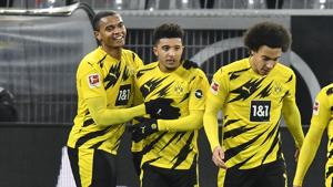 Dortmund's second scorer Jadon Sancho, 2nd left, celebrates with first scorer Manuel Akanji, left, after their side's second goal during the German Bundesliga soccer match between Borussia Dortmund and VfL Wolfsburg in Dortmund, Germany, Sunday, Jan. 3, 2021. (AP Photo/Martin Meissner, Pool)(AP) Dortmund's second scorer Jadon Sancho, 2nd left, celebrates with first scorer Manuel Akanji, left, after their side's second goal during the German Bundesliga soccer match between Borussia Dortmund and VfL Wolfsburg in Dortmund, Germany, Sunday, Jan. 3, 2021. (AP Photo/Martin Meissner, Pool)(AP)