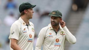 Australia's Cameron Green, left, talks with teammate Nathan Lyon during play on day two of the second cricket test between India and Australia at the Melbourne Cricket Ground.(AP) Australia's Cameron Green, left, talks with teammate Nathan Lyon during play on day two of the second cricket test between India and Australia at the Melbourne Cricket Ground.(AP)