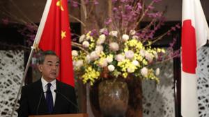 Wang Yi, China's foreign minister, speaks during a press conference in Tokyo, Japan, on Tuesday, Nov. 24, 2020. Photographer: Issei Kato/Reuters/Bloomberg