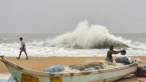 Cishermen work at a beach in the backdrop of a rough sea due to Cyclone Amphan, at Mamallapuram in Chengalpattu district.(PTI) Cishermen work at a beach in the backdrop of a rough sea due to Cyclone Amphan, at Mamallapuram in Chengalpattu district.(PTI)