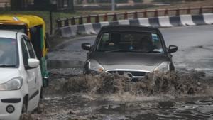 Vehicles crossing a waterlogged stretch after morning rains near AIIMS in New Delhi, India.(Amal KS/HT PHOTO) Vehicles crossing a waterlogged stretch after morning rains near AIIMS in New Delhi, India.(Amal KS/HT PHOTO)