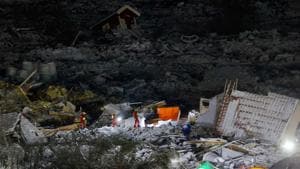 Rescue workers are seen at the landslide in Ask, Gjerdrum, on Jauary 3, 2021.(AFP)
