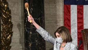 US House Speaker Nancy Pelosi, a Democrat from California, wears a protective mask while waving the Speaker's gavel during the first session of the 117th Congress in the House Chamber in Washington, DC.(Bloomberg) US House Speaker Nancy Pelosi, a Democrat from California, wears a protective mask while waving the Speaker's gavel during the first session of the 117th Congress in the House Chamber in Washington, DC.(Bloomberg)