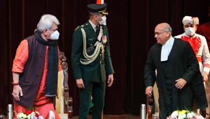 Lieutenant Governor of Jammu and Kashmir Manoj Sinha congratulates Justice Pankaj Mithal after administering him oath as the Chief Justice of Jammu & Kashmir and Ladakh High Court, in Jammu, Monday.(PTI) Lieutenant Governor of Jammu and Kashmir Manoj Sinha congratulates Justice Pankaj Mithal after administering him oath as the Chief Justice of Jammu & Kashmir and Ladakh High Court, in Jammu, Monday.(PTI)