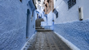 The picturesque town, its facades painted in distinctive hues of blue, shut its small population off from the world, and kept the virus out for months.(Unsplash) The picturesque town, its facades painted in distinctive hues of blue, shut its small population off from the world, and kept the virus out for months.(Unsplash)