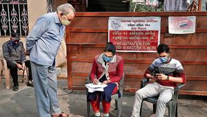 A man registers his name for vaccination against Covid, at a health centre in Ahmedabad.(Reuters) A man registers his name for vaccination against Covid, at a health centre in Ahmedabad.(Reuters)