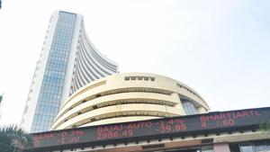 Mumbai: People walk in front of a digital screen at the facade of BSE, as the Sensex crossed 48000 mark for the first time, in Mumbai, Monday, Jan. 4, 2021. (PTI Photo/Shashank Parade) Mumbai: People walk in front of a digital screen at the facade of BSE, as the Sensex crossed 48000 mark for the first time, in Mumbai, Monday, Jan. 4, 2021. (PTI Photo/Shashank Parade)