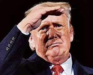 US President Donald Trump looks on during a rally in support of Republican incumbent senators Kelly Loeffler and David Perdue ahead of a Senate runoff in Dalton, Georgia on January 4, 2021.(AFP) US President Donald Trump looks on during a rally in support of Republican incumbent senators Kelly Loeffler and David Perdue ahead of a Senate runoff in Dalton, Georgia on January 4, 2021.(AFP)