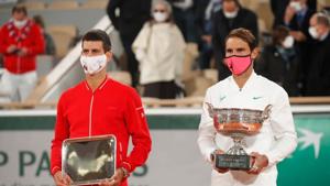 Runner up Novak Djokovic of Serbia alongside French Open winner Rafael Nadal of Spain as they are presented with their trophies after the final.(REUTERS) Runner up Novak Djokovic of Serbia alongside French Open winner Rafael Nadal of Spain as they are presented with their trophies after the final.(REUTERS)