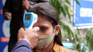 A volunteer wearing a protective mask has her temperature taken during a nationwide trial of a Covid-19 vaccine delivery system in New Delhi on January 2. India on January 5 recorded 16,375 new cases of coronavirus disease (Covid-19), the lowest in more than six months, according to the Union Health Ministry. (T Narayan / Bloomberg) A volunteer wearing a protective mask has her temperature taken during a nationwide trial of a Covid-19 vaccine delivery system in New Delhi on January 2. India on January 5 recorded 16,375 new cases of coronavirus disease (Covid-19), the lowest in more than six months, according to the Union Health Ministry. (T Narayan / Bloomberg)
